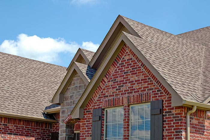 close up of a brick house's new roof